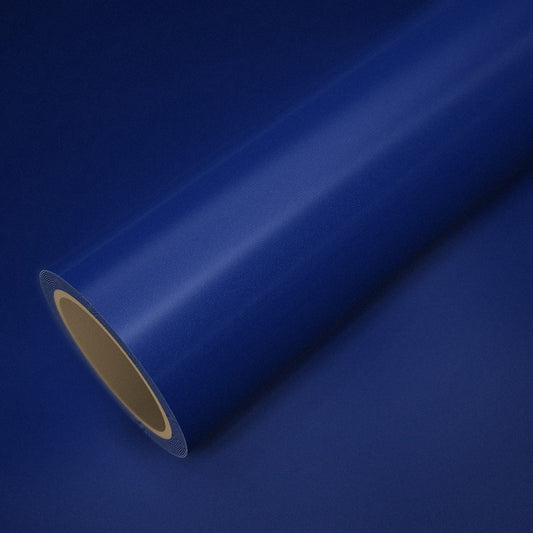 Rouleau de vinyle bleu métallisé posé sur une feuille du même vinyle